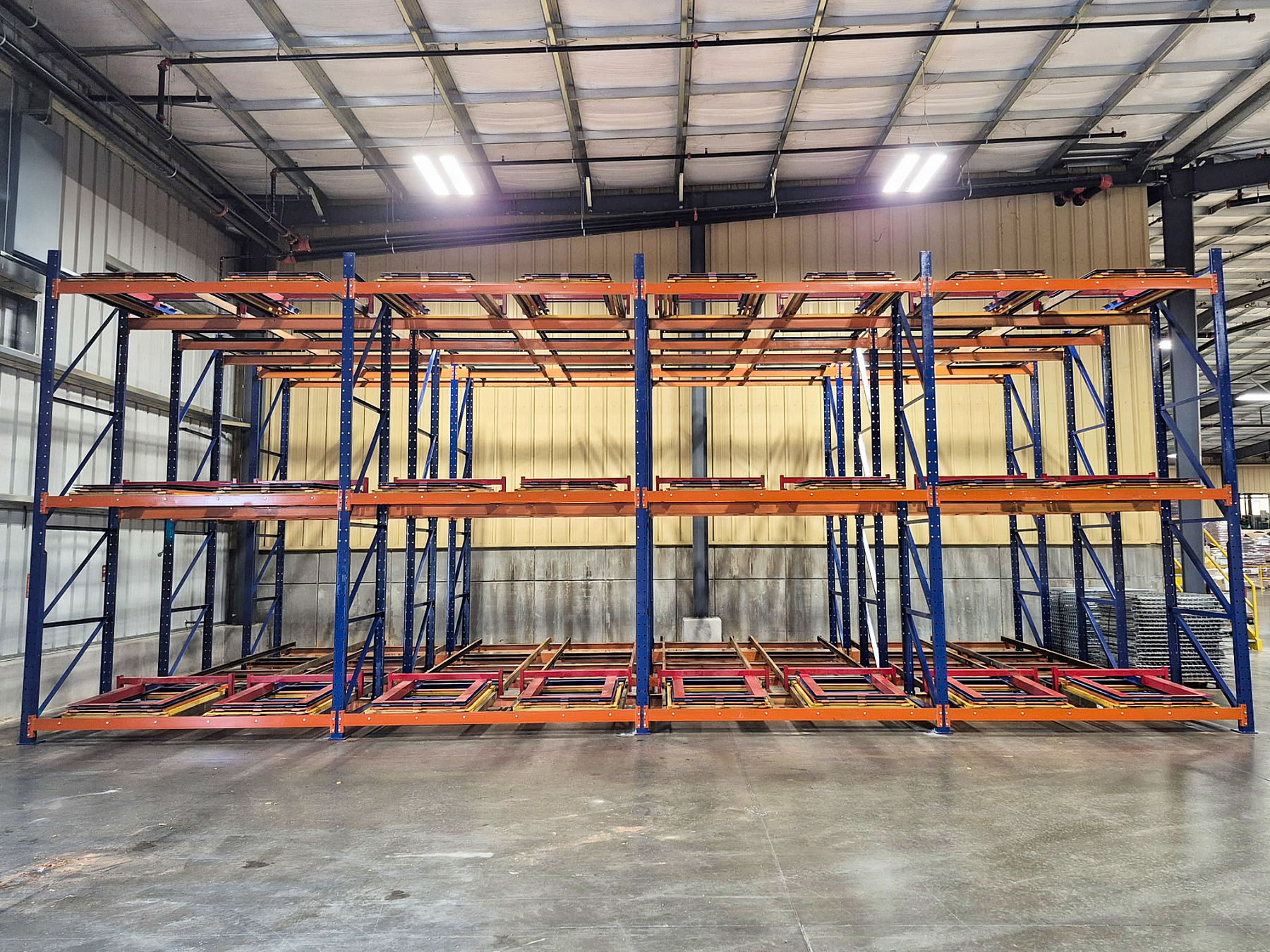Four deep pushback rack system used for warehouse storage solutions