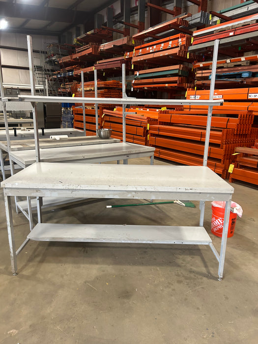 Grey office desk with book shelf