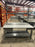 Grey office desk with book shelf
