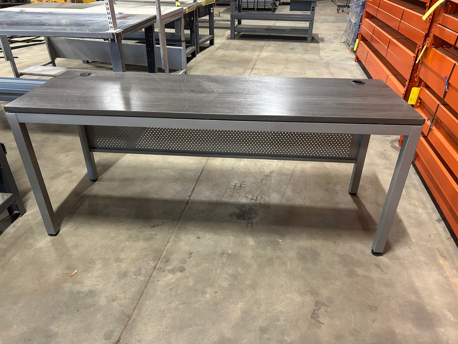 Grey office desk with book shelf