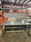 Grey office desk with book shelf