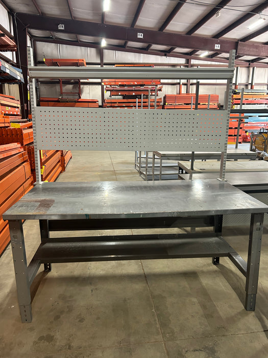 Grey office desk with book shelf